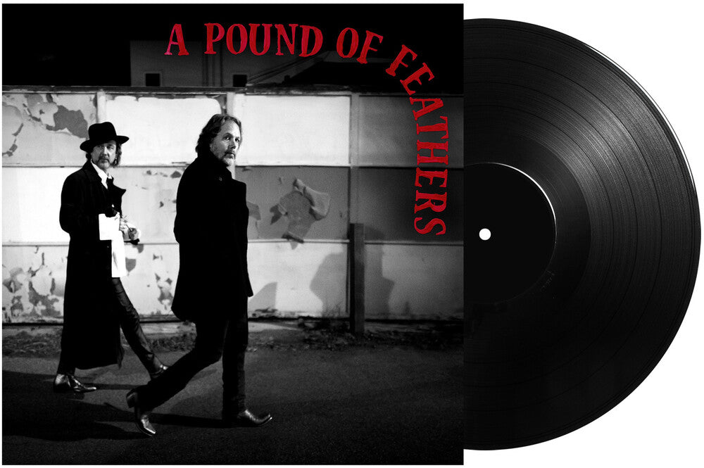 the album cover for The Black Crowes - A Pound Of Feathers